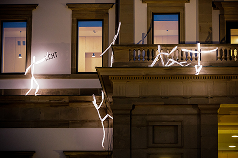 Public light art installation with LED light sculptures at night in Stuttgart